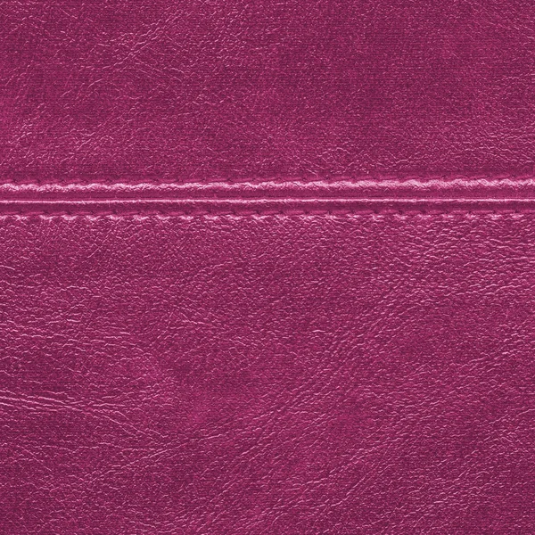 Crimson läder bakgrund pryds av en söm — Stockfoto