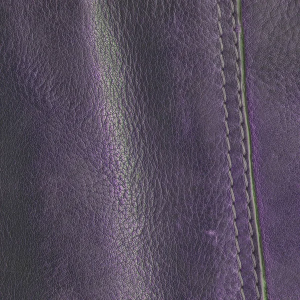 Violet lederen achtergrond versierd met naad — Stockfoto