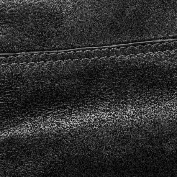 Textura de couro preto close-up, costura — Fotografia de Stock