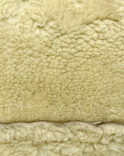 Fragmento de cuello de piel artificial beige como fondo —  Fotos de Stock