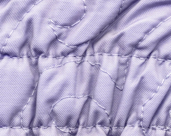 Licht violet verfrommeld textiel achtergrond — Stockfoto
