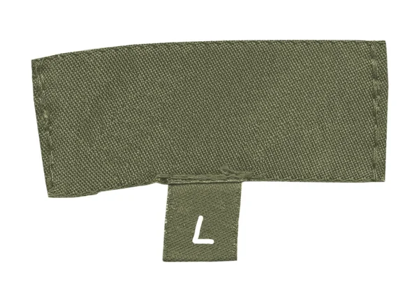Eski yeşil tekstil etiket üzerindeki beyaz — Stok fotoğraf