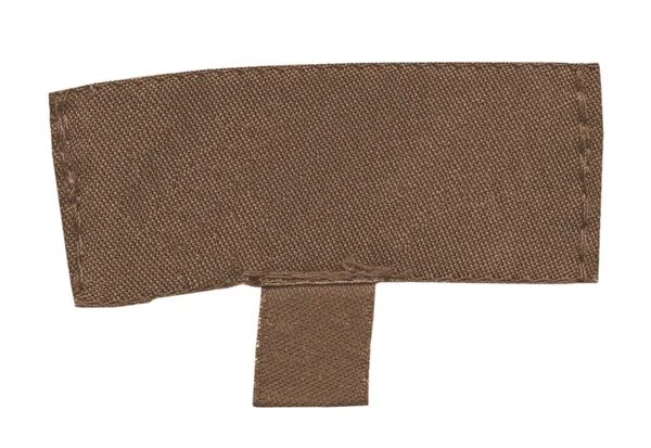Vieux tissu brun étiquette vide sur fond blanc — Photo