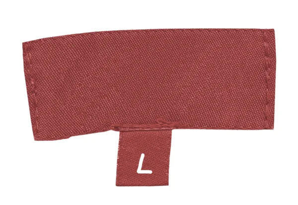 Altes rotes Textiletikett isoliert auf weiß — Stockfoto