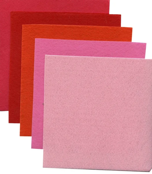 Squares of material of different tints of red — Stock Photo, Image