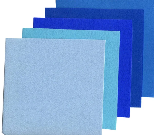 Squares of material of different tints of blue — Stock Photo, Image