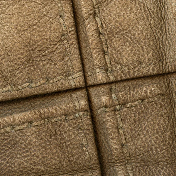 Fragment of female jacket as brown leather background — Stock Photo, Image