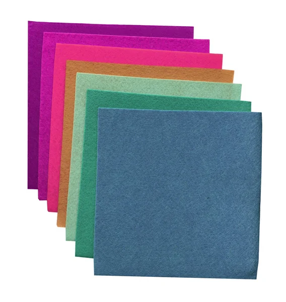 Cuadrados multicolores de material apilados juntos en blanco — Foto de Stock