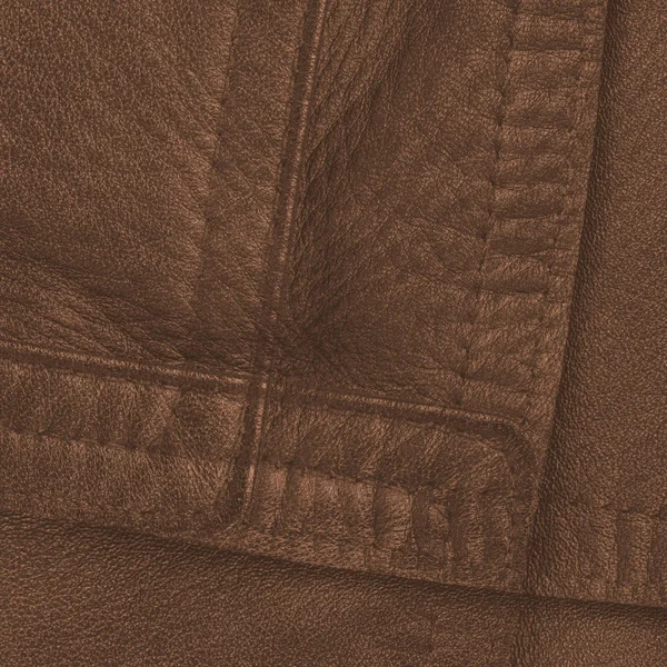 Fragment of leather coat as brown leather background — Stock Photo, Image