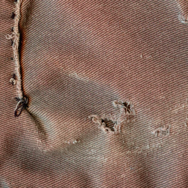 Stare tekstury shabby i rozdarty materiał czerwonawo brązowy — Zdjęcie stockowe