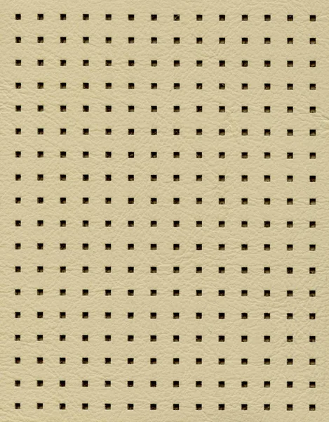 Light beige perforated artificial leather texture — Stock Photo, Image