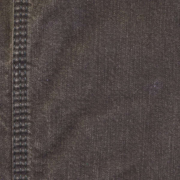 背景として茶色のジーンズのフラグメント — ストック写真