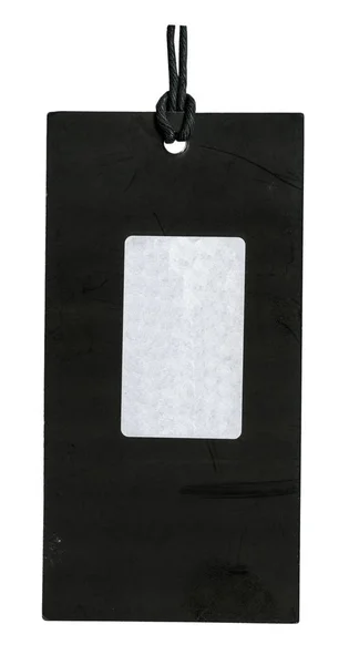 Schwarzer alter Kartonanhänger mit weißem Papieraufkleber — Stockfoto