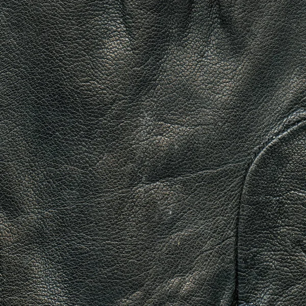 Hintergrund aus schwarzem Leder. nützlich für Design-Arbeiten — Stockfoto