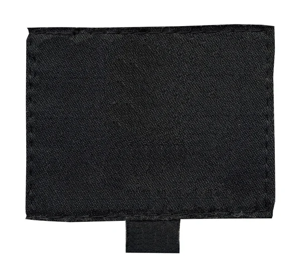Etiqueta têxtil preta em branco isolada sobre fundo branco — Fotografia de Stock