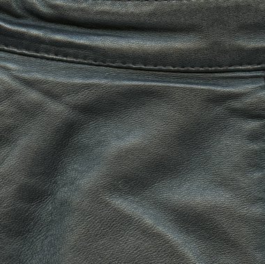 crumped siyah deri, bir dikiş arka plan 