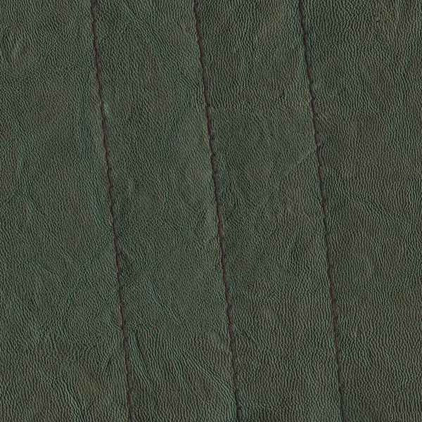 绿色皮革背景装饰带缝 — 图库照片