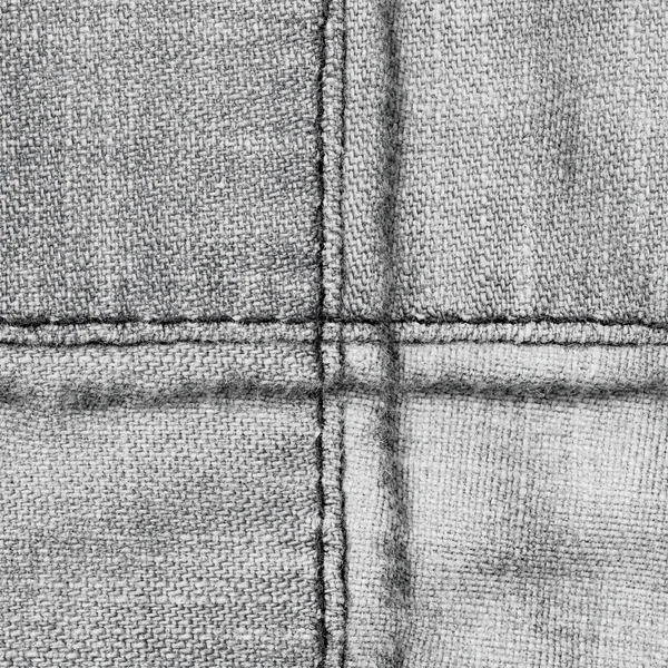 十字の形の縫い目で飾られた灰色デニム バック グラウンド — ストック写真