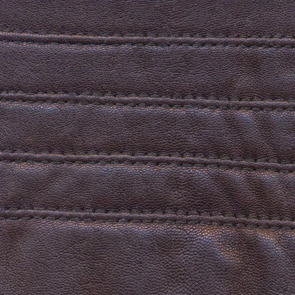 設計仕事のために便利の縫い目で飾られた古い茶色の革の背景 — ストック写真