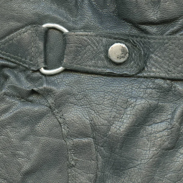 fragment of old leather coat as black leather background