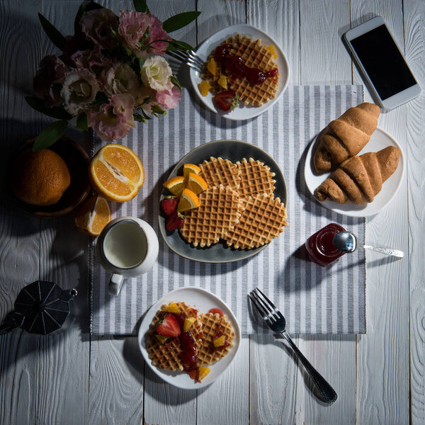 Fresh tasty breakfast with waffles 