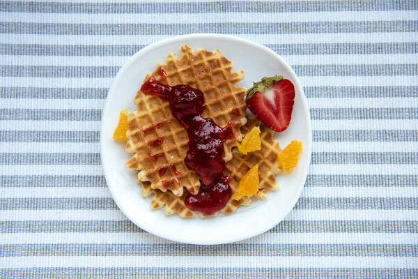 Fresh tasty breakfast with waffles 