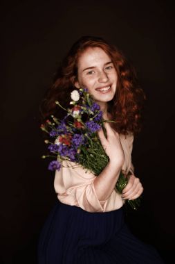redhead girl holding cornflowers clipart