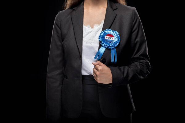 businesswoman with vote badge