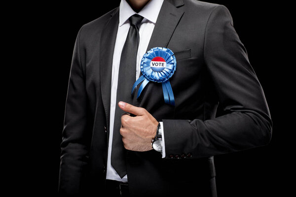 businessman with vote badge