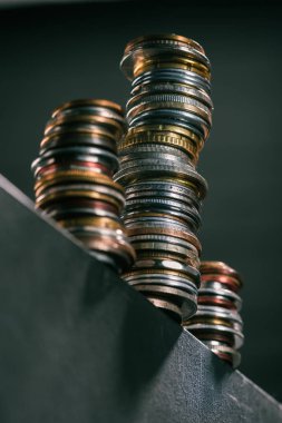 stacks of coins on table clipart