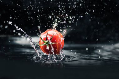 fresh tomato falling in water clipart