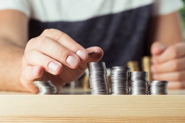 person stacking coins  clipart