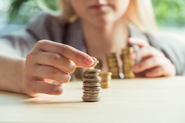 woman stacking coins 