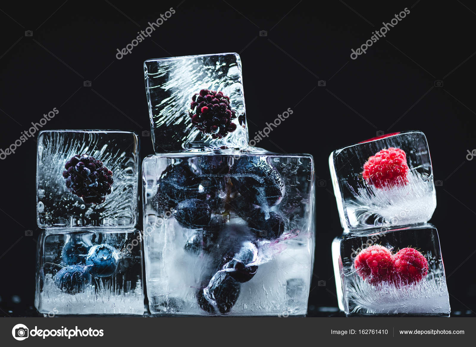 Frozen fruits in ice cubes Stock Photo by ©VadimVasenin 162761410