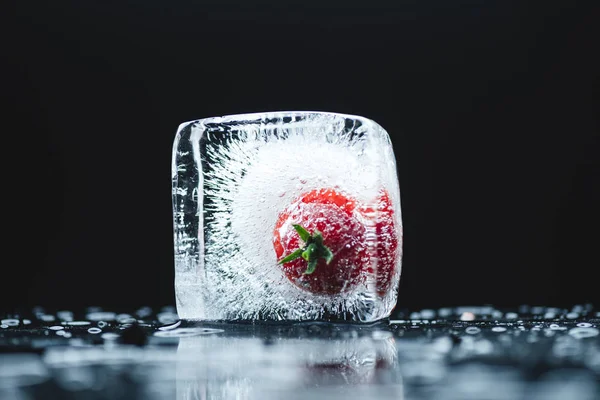 Cherry tomato in ice cube — Stock Photo, Image