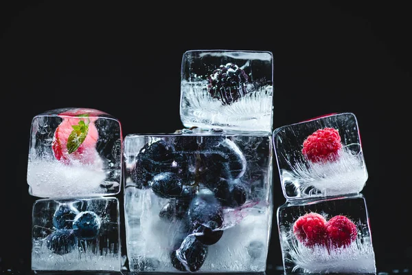 Frozen fruits in ice cubes — Stock Photo, Image