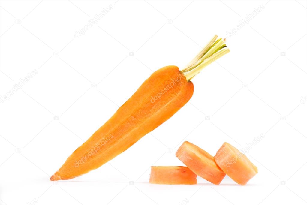 fresh ripe carrot with stack of slices