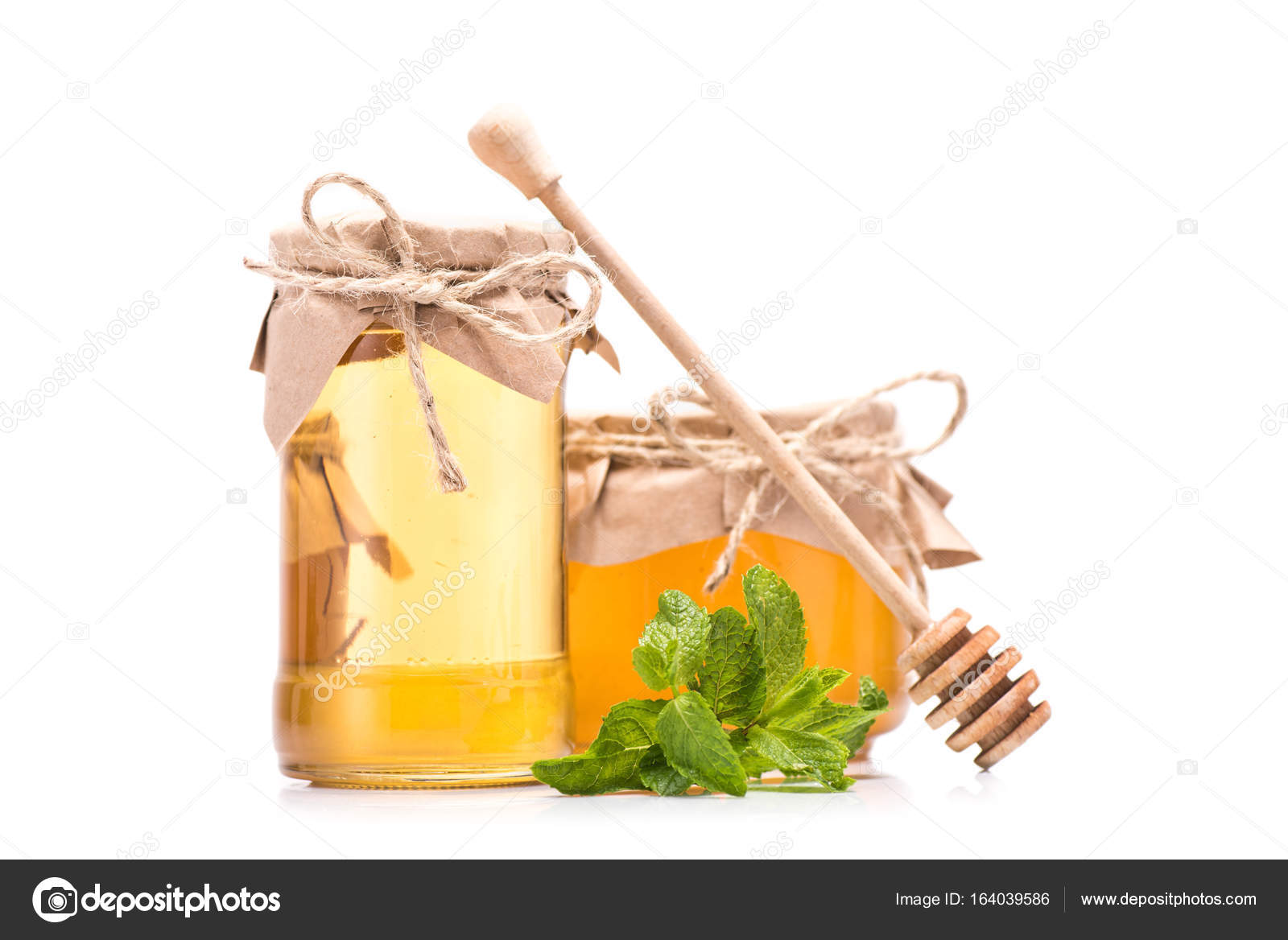 Fresh honey in glass jars Stock Photo by ©VadimVasenin 164039586