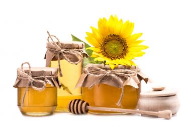 sunflower and honey in glass jars  clipart