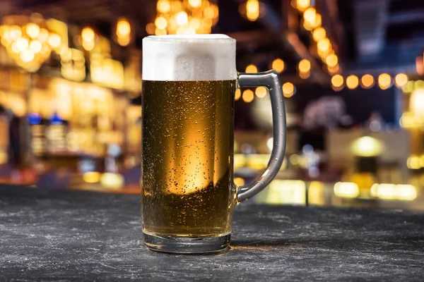 Glass of beer on table — Stock Photo, Image