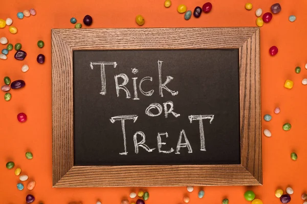 Chalkboard with trick or treat inscription — Stock Photo, Image