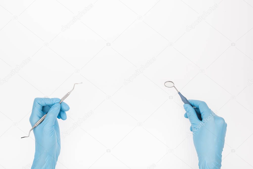 professional dentist with probe and mirror