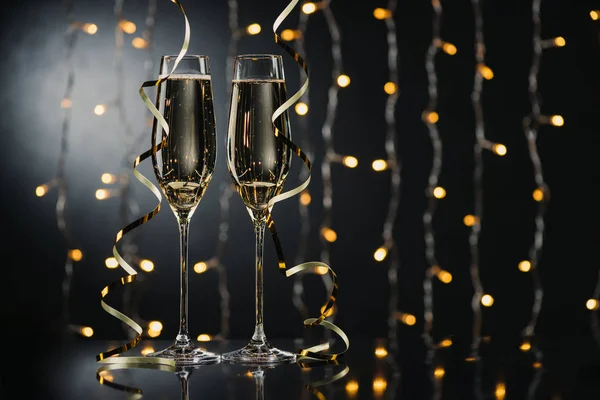 Glasses of champagne with ribbons — Stock Photo, Image