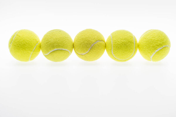 tennis balls in row