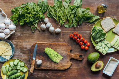 fresh avocado on cutting board clipart