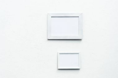 empty photo frames hanging on wall clipart