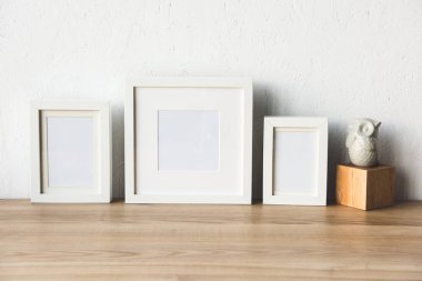 empty photo frames on table clipart