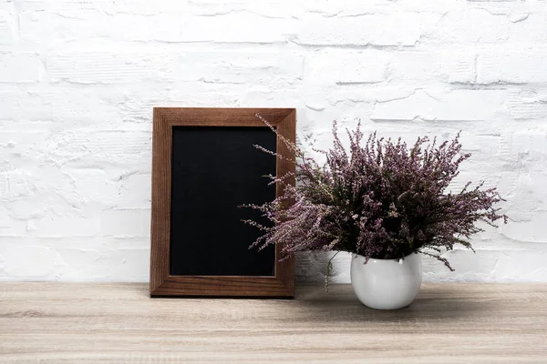 Empty photo frame at workplace — Stock Photo, Image