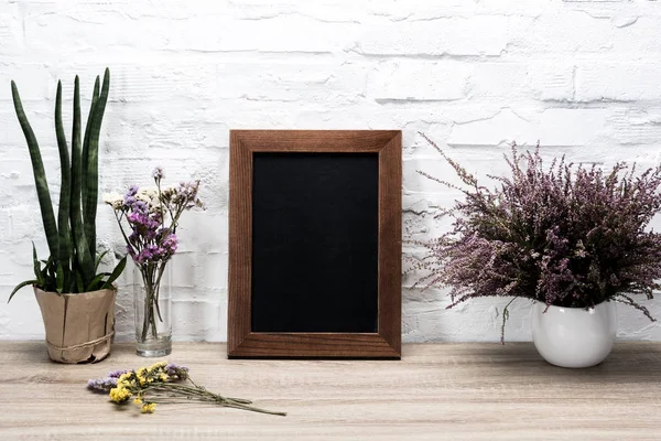 Empty photo frame at workplace — Stock Photo, Image