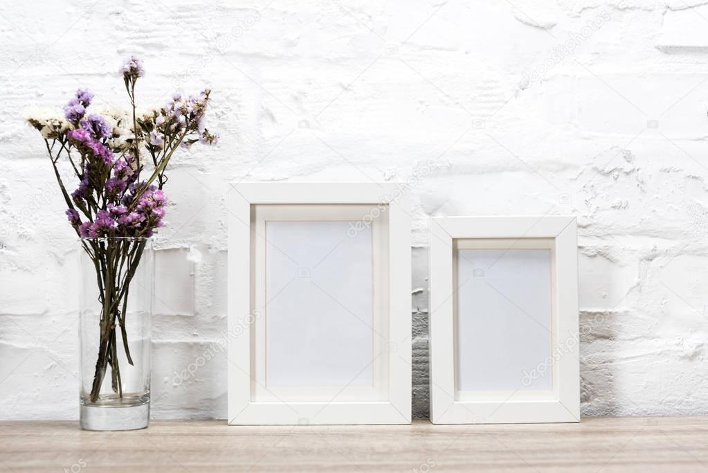 photo frames and flowers in vase